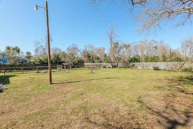 view of yard featuring a fenced backyard