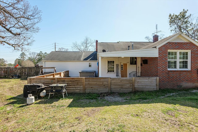 rear view of property with a yard and fence private yard