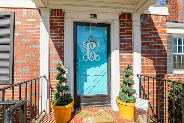 entrance to property with brick siding