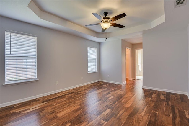 5776 Carriage Hills Dr, Martinez, GA 30907 - empty room with a ceiling fan, dark wood-type flooring, and a tray ceiling