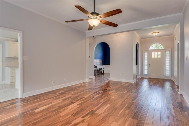 5776 Carriage Hills Dr, Martinez, GA 30907 - foyer featuring arched walkways, wood finished floors, a ceiling fan, and ornamental molding