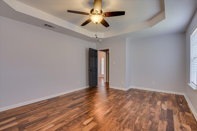 5776 Carriage Hills Dr, Martinez, GA 30907 - unfurnished room featuring a raised ceiling, a ceiling fan, and dark wood finished floors