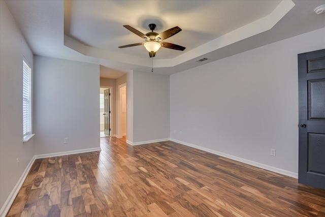 5776 Carriage Hills Dr, Martinez, GA 30907 - spare room with a tray ceiling, ceiling fan, wood finished floors, and a smoke detector
