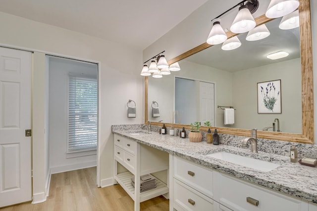 3408 Wheeler Rd, Augusta, GA 30909 - full bathroom with double vanity, wood finished floors, a chandelier, and baseboards