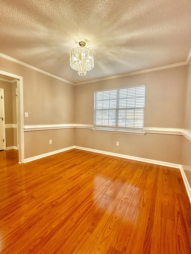 unfurnished living room with built in shelves, ceiling fan, light wood-type flooring, and a textured ceiling