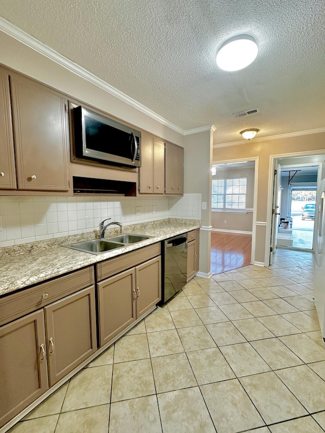 kitchen featuring sink, light tile patterned floors, stainless steel appliances, and ornamental molding