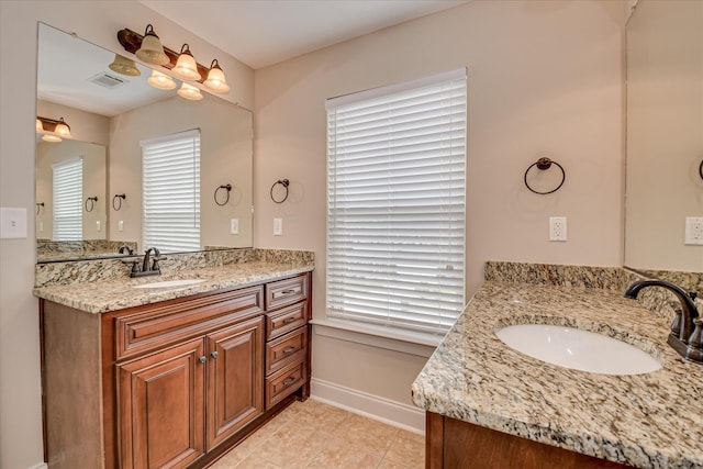 514 Hardwick Ct, Evans, GA 30809 - bathroom with two vanities, baseboards, and tile patterned flooring