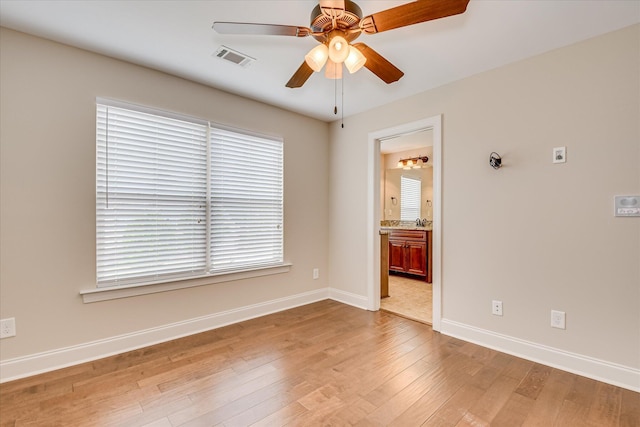 514 Hardwick Ct, Evans, GA 30809 - spare room featuring a ceiling fan, light wood-style floors, baseboards, and a sink