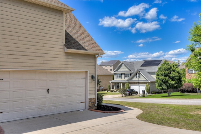 514 Hardwick Ct, Evans, GA 30809 - view of home's exterior with roof with shingles, a garage, a lawn, a residential view, and stone siding
