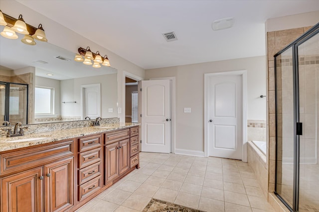514 Hardwick Ct, Evans, GA 30809 - bathroom with tile patterned floors, a stall shower, double vanity, a garden tub, and baseboards