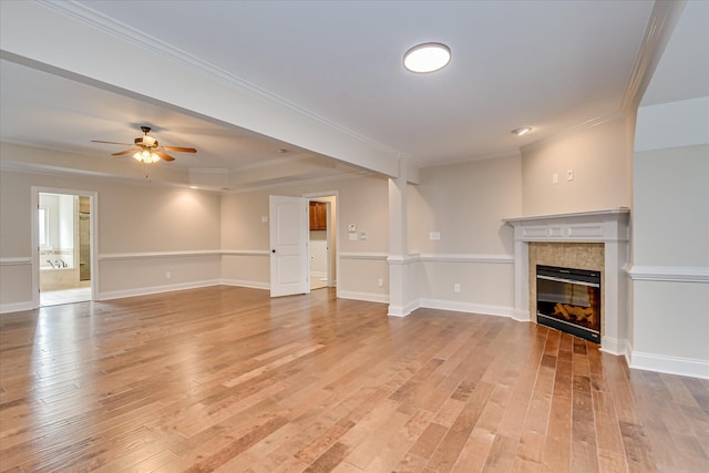 514 Hardwick Ct, Evans, GA 30809 - unfurnished living room with light wood-style flooring, ceiling fan, a tiled fireplace, ornamental molding, and baseboards