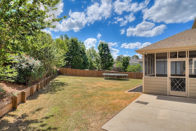 514 Hardwick Ct, Evans, GA 30809 - view of yard featuring a trampoline, a patio, and a sunroom