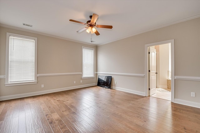 514 Hardwick Ct, Evans, GA 30809 - unfurnished living room featuring a ceiling fan, hardwood / wood-style flooring, crown molding, and baseboards