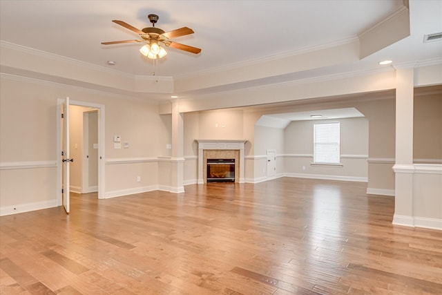 514 Hardwick Ct, Evans, GA 30809 - unfurnished living room with ceiling fan, light wood-type flooring, crown molding, a glass covered fireplace, and baseboards