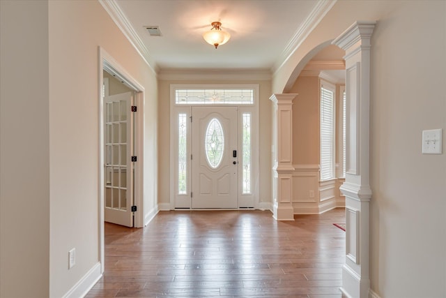 514 Hardwick Ct, Evans, GA 30809 - entrance foyer with arched walkways, hardwood / wood-style flooring, crown molding, and decorative columns