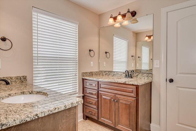 514 Hardwick Ct, Evans, GA 30809 - bathroom featuring two vanities, tile patterned floors, and baseboards