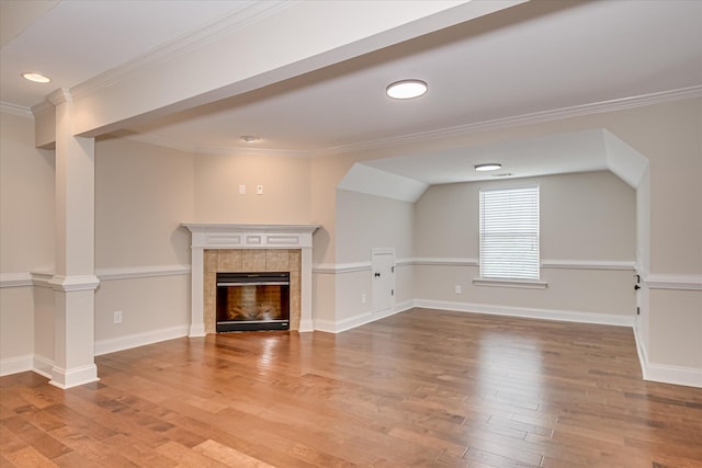 514 Hardwick Ct, Evans, GA 30809 - unfurnished living room featuring light wood finished floors, ornamental molding, a tile fireplace, baseboards, and recessed lighting