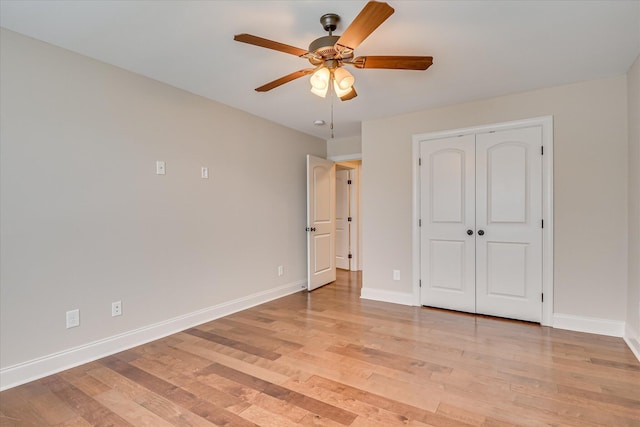 514 Hardwick Ct, Evans, GA 30809 - unfurnished bedroom with light wood-type flooring, baseboards, a ceiling fan, and a closet