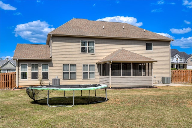 514 Hardwick Ct, Evans, GA 30809 - back of property with central AC, a sunroom, a trampoline, and roof with shingles