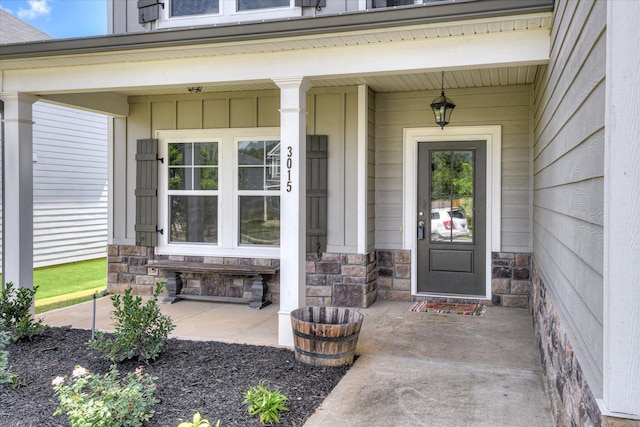 3015 Bannack Ln, Harlem, GA 30814 - doorway to property featuring covered porch, board and batten siding, and stone siding
