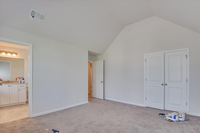 3015 Bannack Ln, Harlem, GA 30814 - unfurnished bedroom with lofted ceiling, light colored carpet, ensuite bath, and a closet