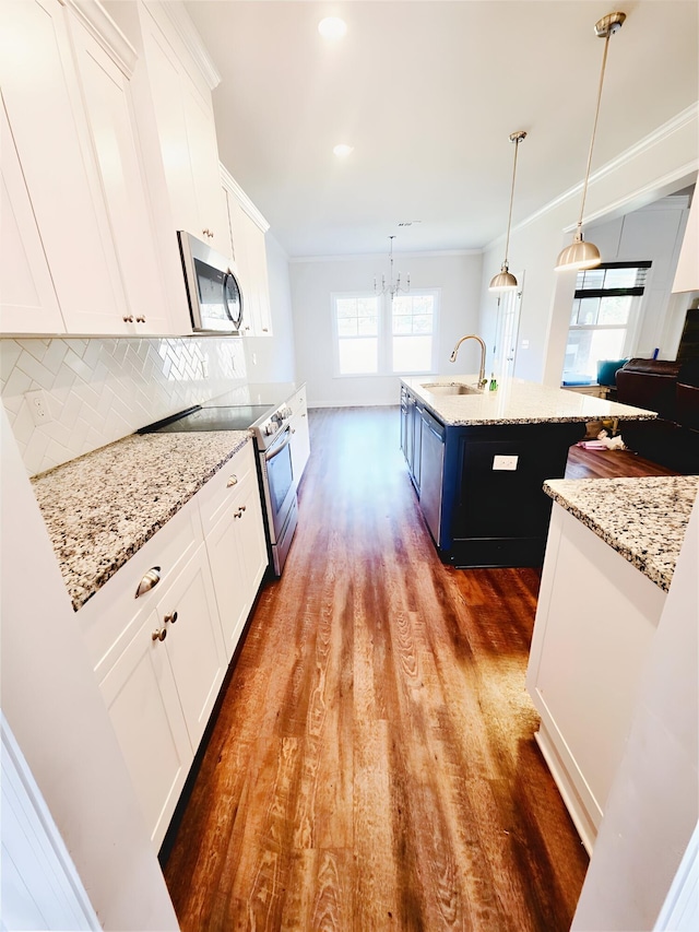 3015 Bannack Ln, Harlem, GA 30814 - kitchen featuring appliances with stainless steel finishes, dark wood-style flooring, an island with sink, a chandelier, and white cabinetry