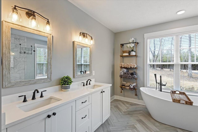 full bath with a soaking tub, tiled shower, a sink, and double vanity