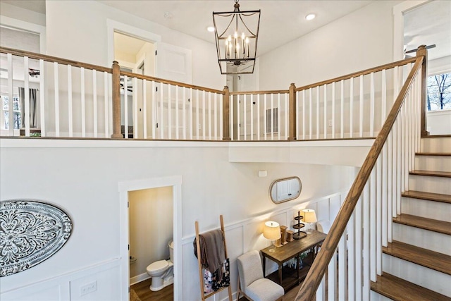 staircase featuring a notable chandelier and recessed lighting