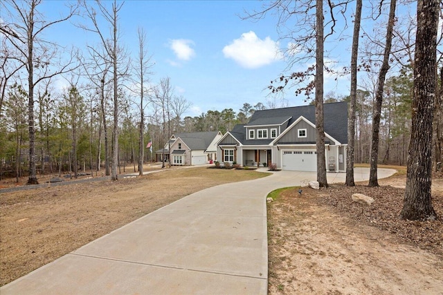 craftsman-style house featuring concrete driveway and board and batten siding