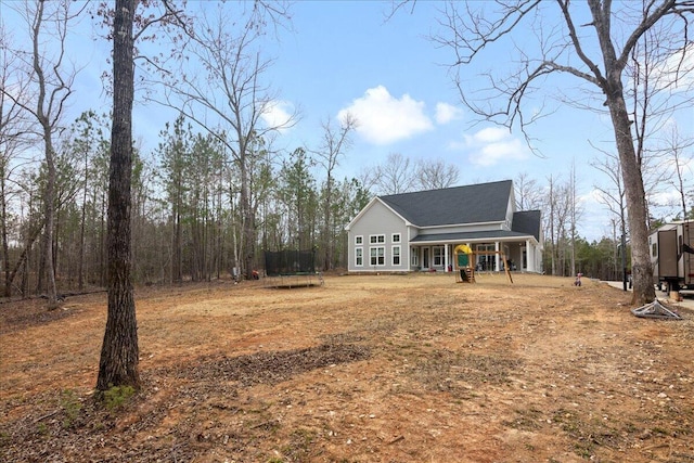 exterior space featuring a trampoline and covered porch