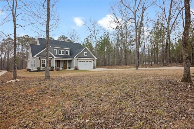 view of front of home featuring a garage, a porch, and board and batten siding