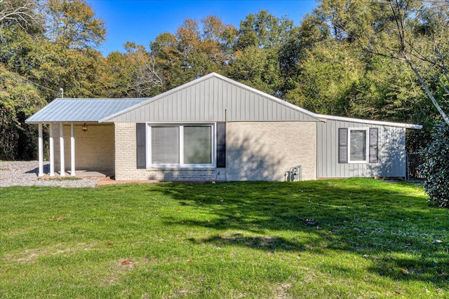 view of side of property with a yard