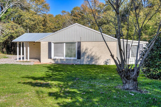 view of side of home featuring a yard