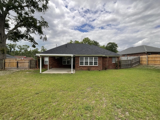 1129 Waltons Trl, Hephzibah, GA 30815 - back of house featuring a patio and brick siding