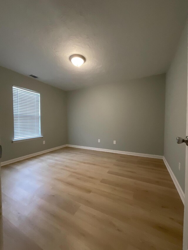 1129 Waltons Trl, Hephzibah, GA 30815 - empty room featuring light wood-type flooring and baseboards