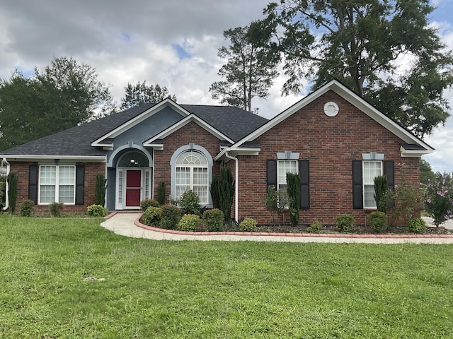 1129 Waltons Trl, Hephzibah, GA 30815 - ranch-style house with brick siding, a front lawn, and roof with shingles