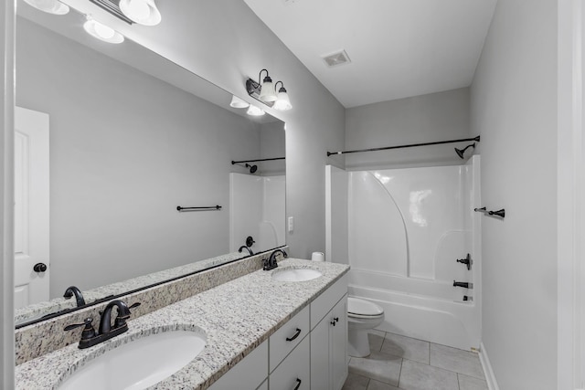 full bathroom with tile patterned flooring, bathtub / shower combination, vanity, and toilet