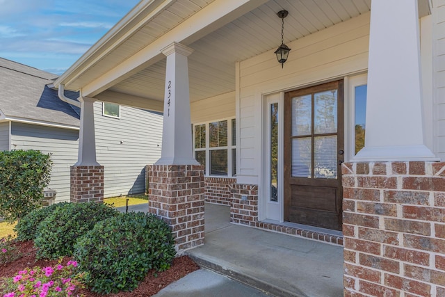 doorway to property featuring covered porch