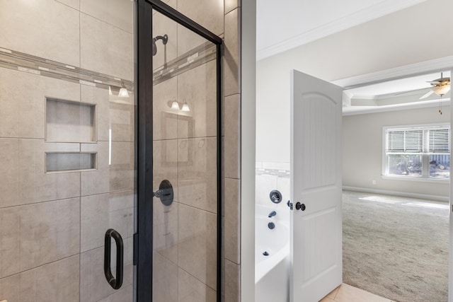 bathroom with ceiling fan, separate shower and tub, and crown molding