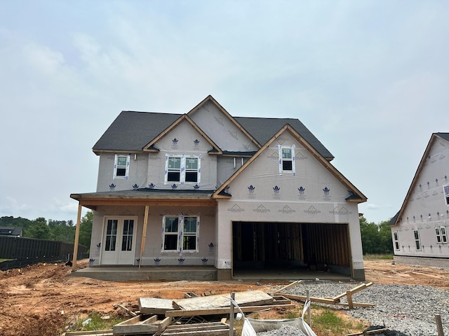 675 Whitney Shoals Rd, Evans, GA 30809 - unfinished property with stucco siding, a garage, and a vegetable garden