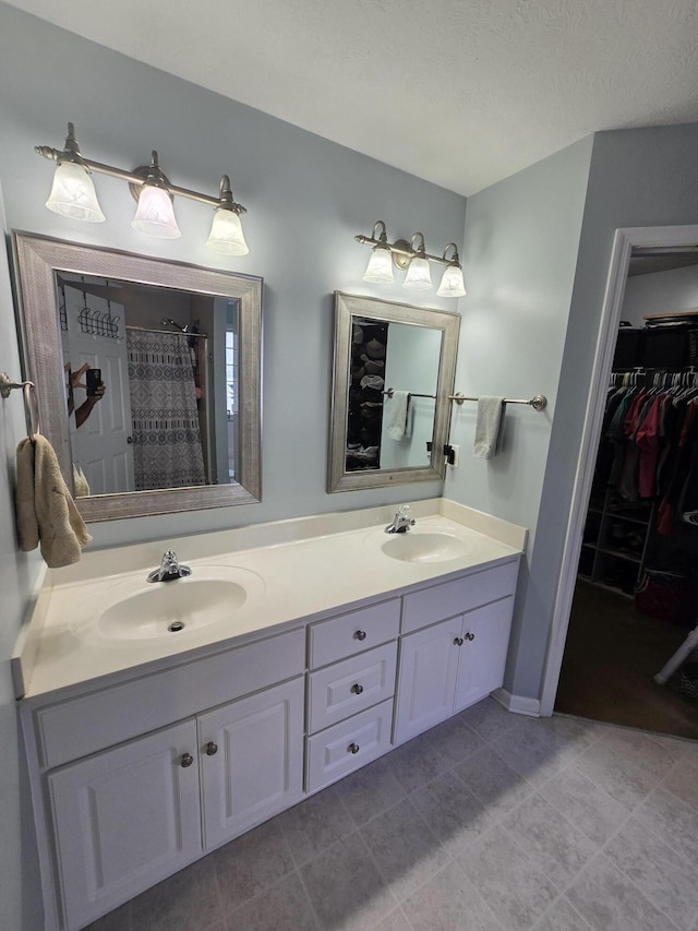 318 Elbrus Way, Grovetown, GA 30813 - bathroom featuring double vanity, a walk in closet, tile patterned flooring, and a shower with shower curtain
