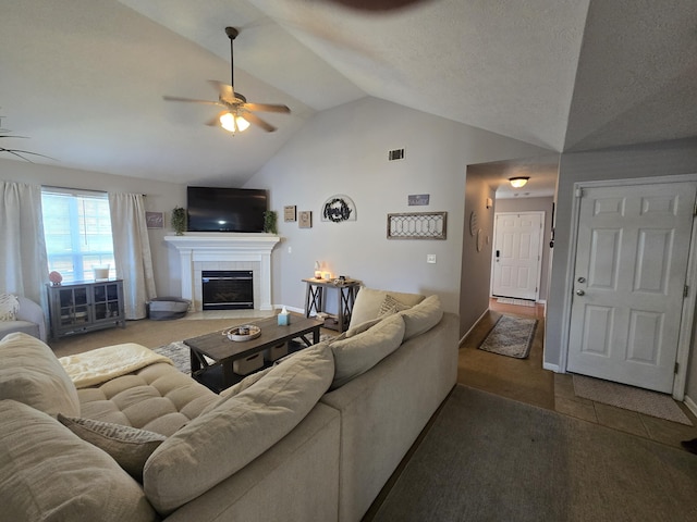 318 Elbrus Way, Grovetown, GA 30813 - tiled living area with lofted ceiling, a ceiling fan, and a tiled fireplace