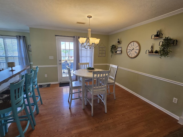 318 Elbrus Way, Grovetown, GA 30813 - dining room featuring a chandelier, plenty of natural light, dark wood-style floors, a textured ceiling, and ornamental molding