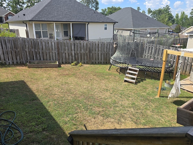 318 Elbrus Way, Grovetown, GA 30813 - fenced backyard with a trampoline