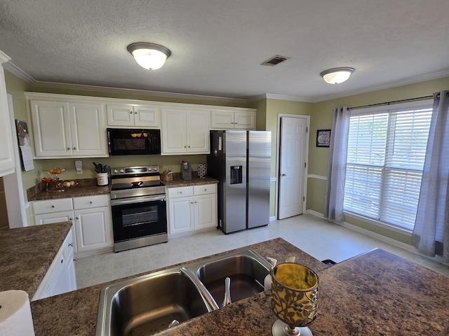 318 Elbrus Way, Grovetown, GA 30813 - kitchen featuring appliances with stainless steel finishes, dark countertops, white cabinetry, crown molding, and a textured ceiling