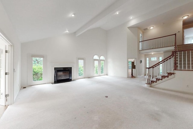 126 Hunters Run Dr, Aiken, SC 29803 - unfurnished living room featuring high vaulted ceiling, carpet floors, a high end fireplace, healthy amount of natural light, and beamed ceiling