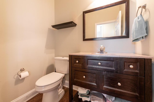 5209 Windmill Ct, Evans, GA 30809 - half bath featuring baseboards, toilet, vanity, and wood finished floors