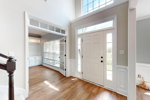 5209 Windmill Ct, Evans, GA 30809 - entrance foyer featuring wood finished floors, ornamental molding, and a wainscoted wall