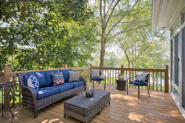 wooden terrace with an outdoor hangout area