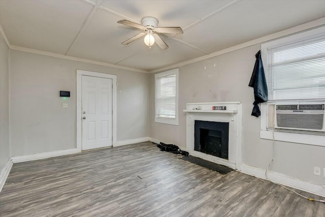 unfurnished living room featuring hardwood / wood-style floors, ceiling fan, cooling unit, and ornamental molding